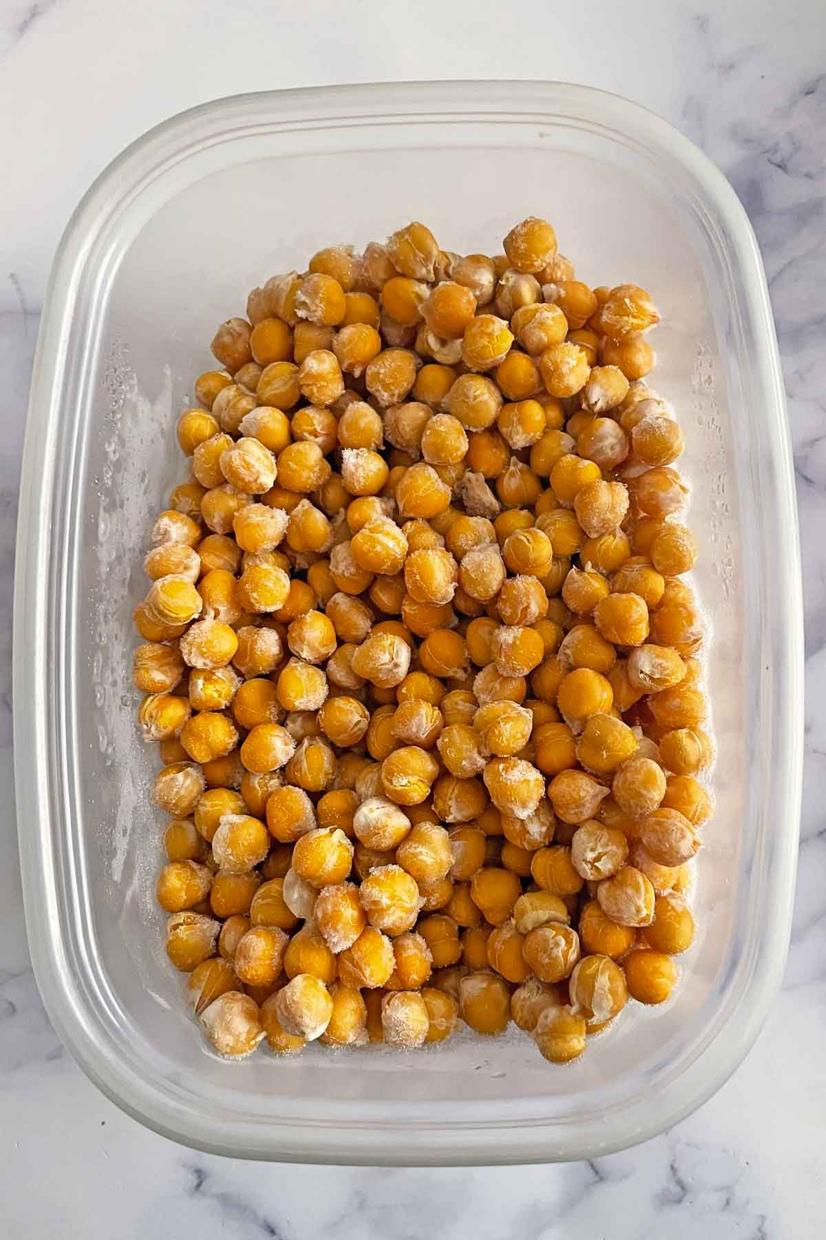 frozen chickpeas in a container.