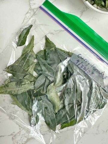 frozen curry leaves in a ziplock bag.