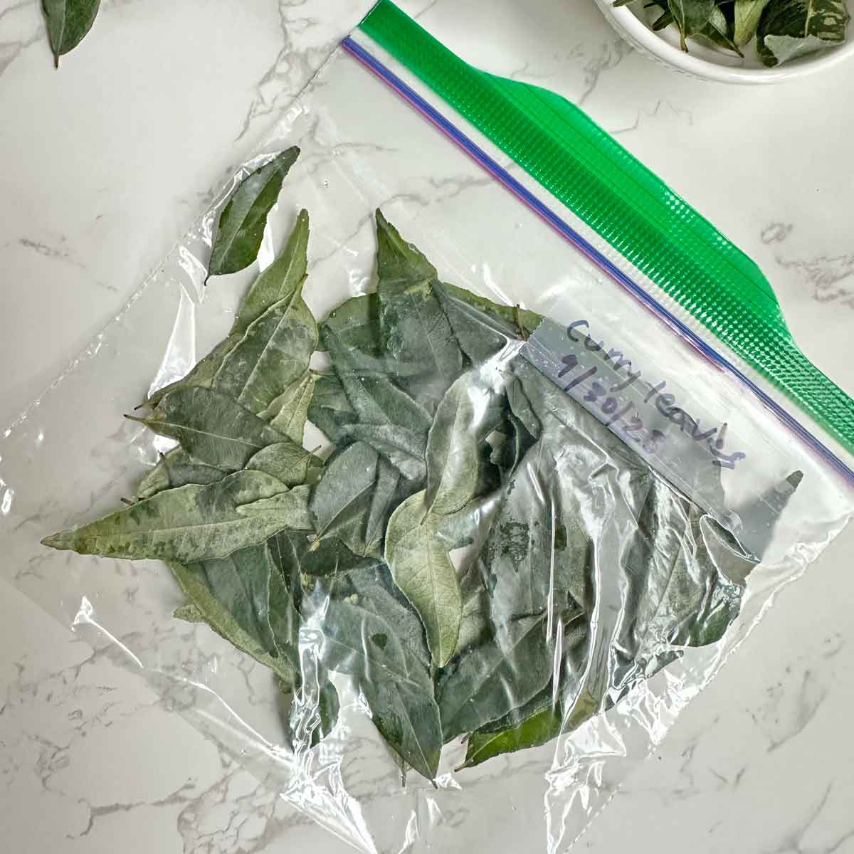 frozen curry leaves in a ziplock bag.