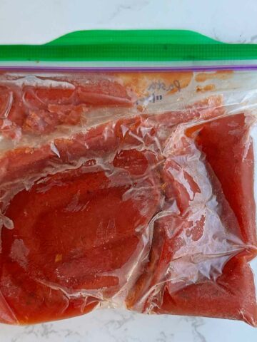 frozen pasta sauce in ziplock bag.