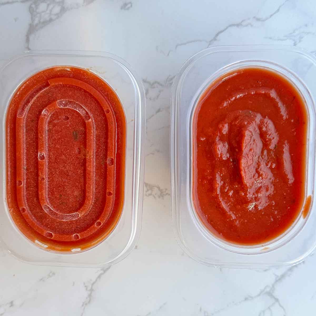 frozen and thawed pasta sauce in containers.