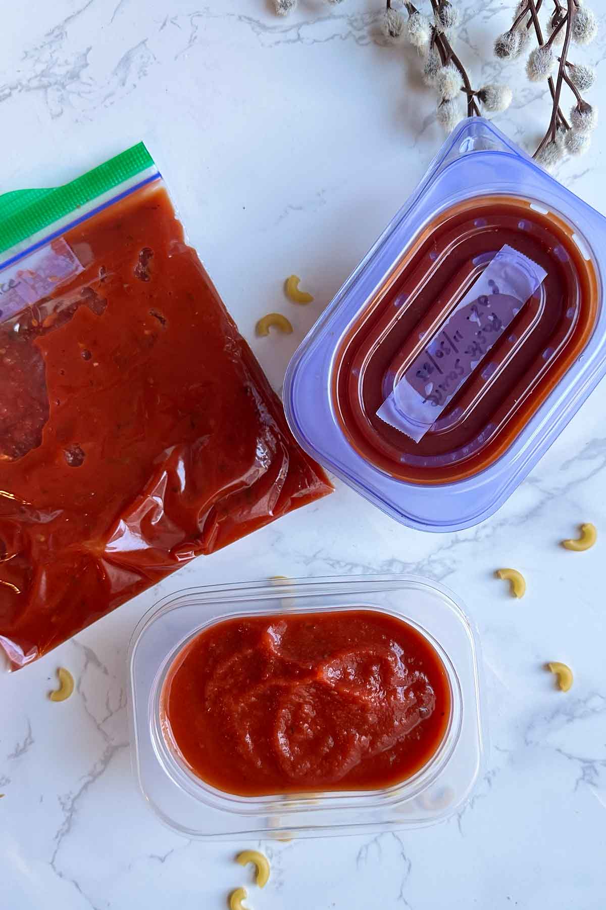 pasta sauce in ziplock bag and container.