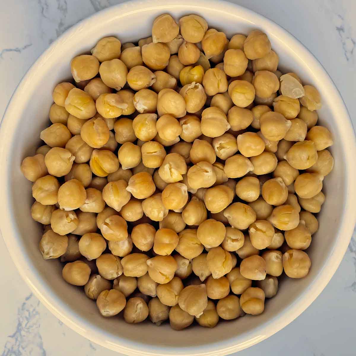 cooked chickpeas in storage container.