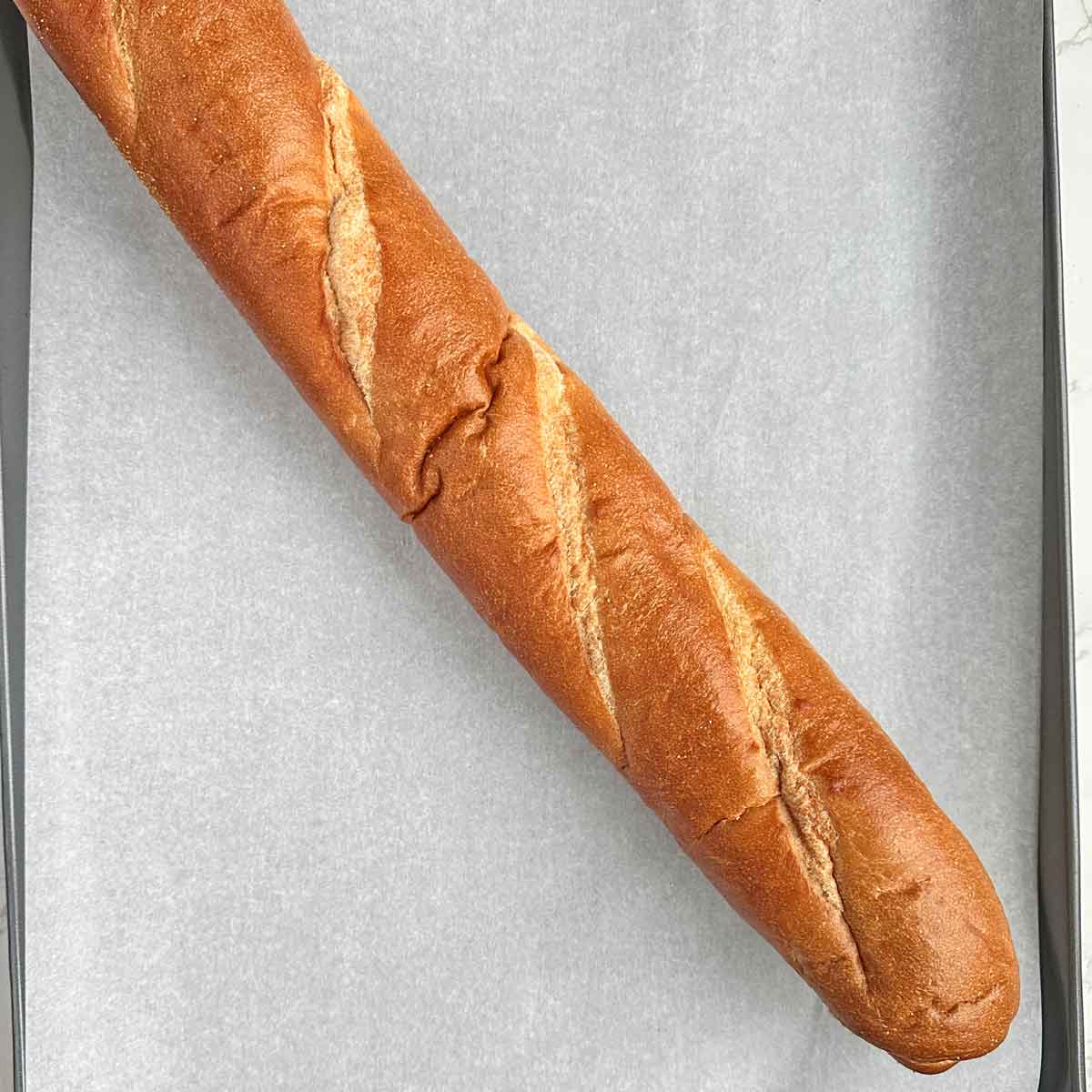 frozen baguette in a baking tray.