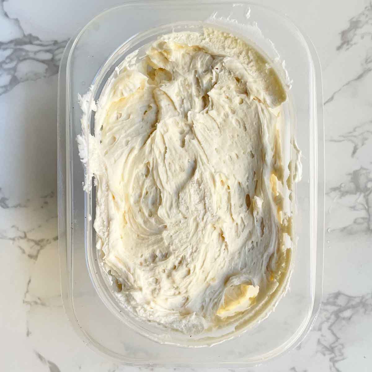frozen buttercream frosting in a container.
