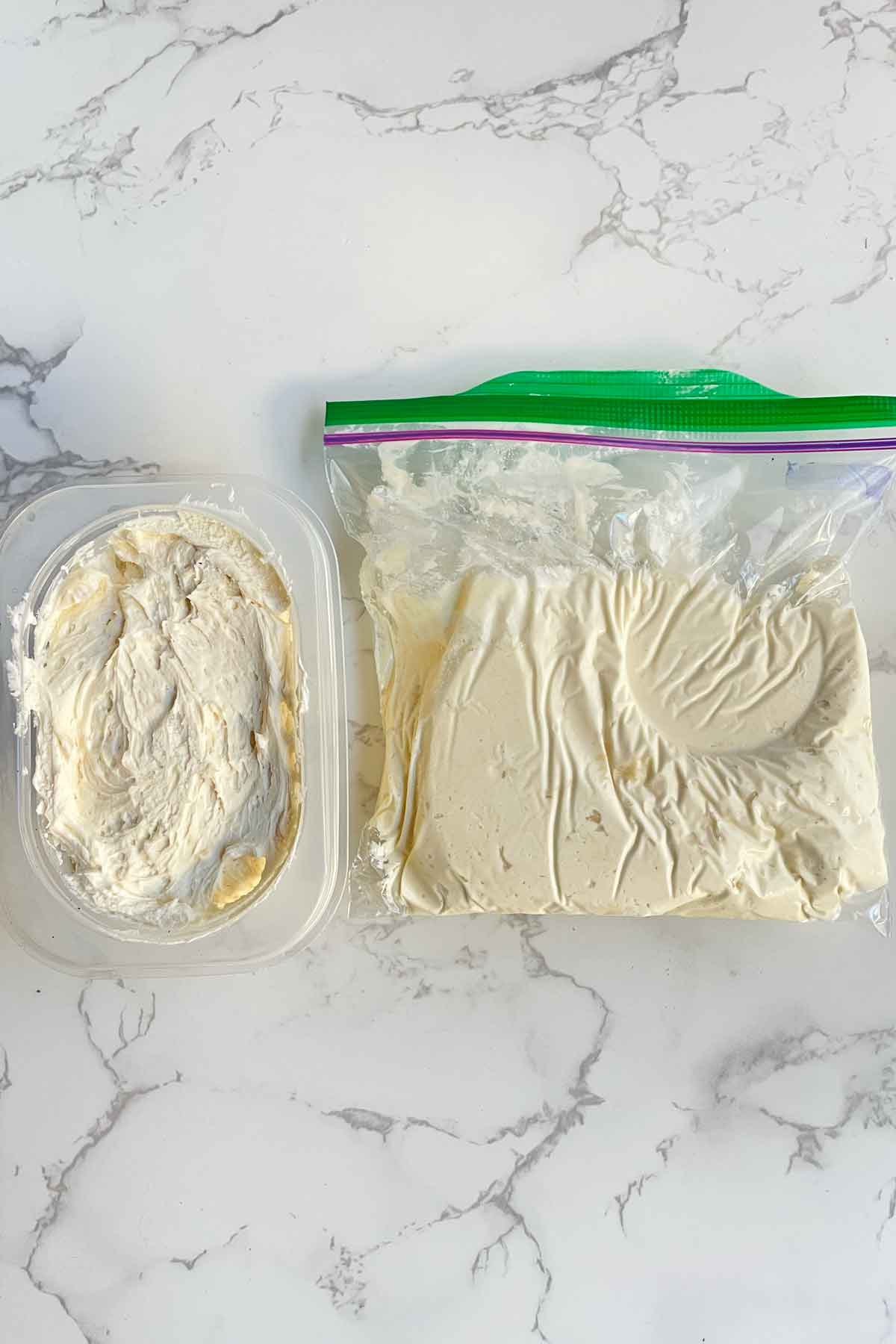 frozen buttercream frosting in a container and ziplock bag.