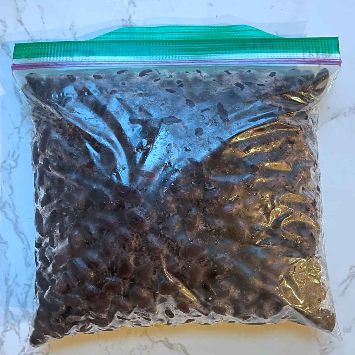 cooked black beans in a ziplock bag.