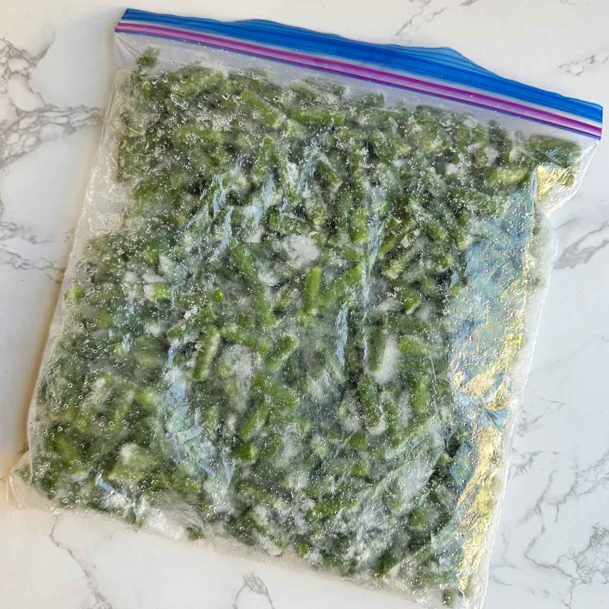 Frozen green beans in ziplock bag.