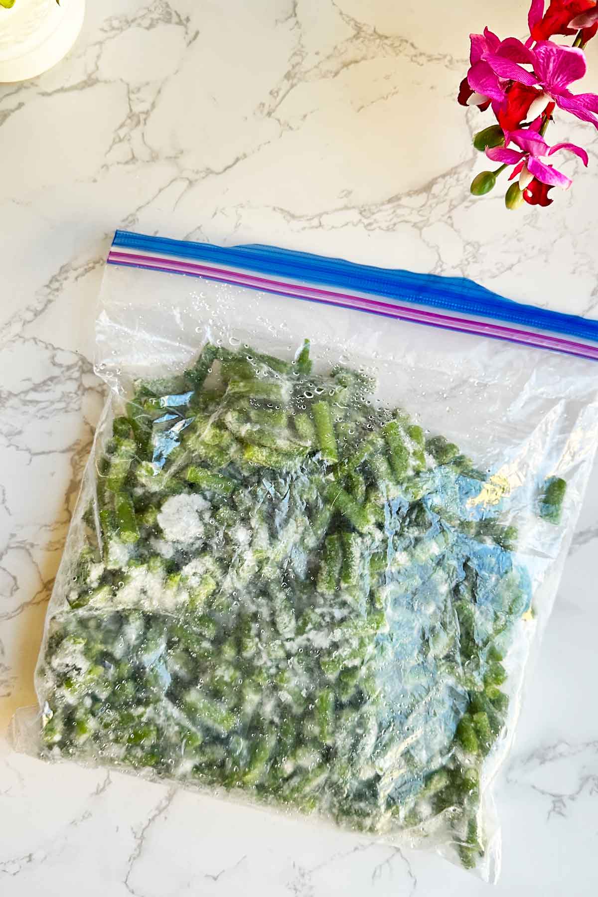 Frozen green beans in ziplock bag.