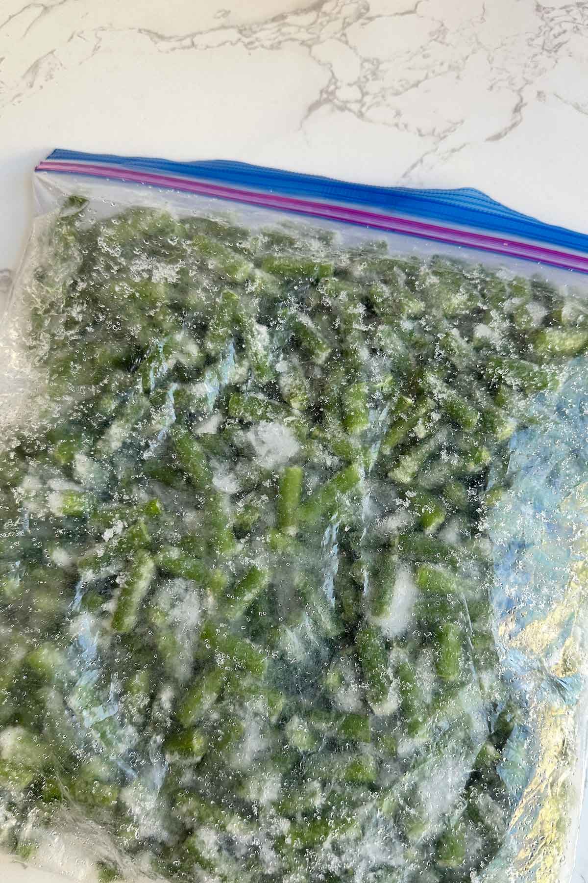 Frozen green beans in ziplock bag.